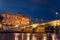 Long Exposition of the Building of the Court of Cassation and a Bridge of the Tevere River Illuminated by Lights at the Blue Hour