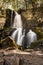 Long Exposure of Baskins Creek Falls and Mossy Boulders Guarding The Edge