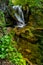 Long exposure of the beautiful La Vaioaga waterfall with green moss, Beusnita