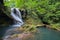 Long exposure of the beautiful La Vaioaga waterfall with green moss, Beusnita, Cheile Nerei National Park, Caras Severin, Romania