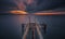 Long exposure clouds moving a pier ruins