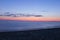 Long exposure dark sea landscape with dusky vibrant orange sky. Seascape  with sunset sky and motion blur water. Marina di Torre d