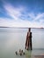 Long exposure daytime stock photo of wooden pylons in Lake Erie