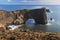 Long exposure of Dyrholaey Arch with smooth water