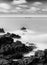 Long exposure greyscale shot of the seascape in Guernsey