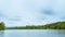 Long exposure of a lake in spring in England giving a soft look to the clouds  on an overcast day