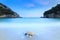 Long exposure landscape of Paleokastritsa famous sand beach in c