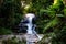 Long exposure of Montha Than waterfall in the jungle of Chiang Mai Thailand