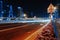 Long exposure of moving cars on night road in Dubai