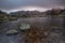 Long exposure nature landscape in retezat mountains with reflections on the lake, at sunset