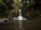 Long exposure panorama of idyllic tropical Kauri tree forest waterfall Waiau Falls near Coromandel Waikato New Zealand