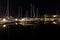 Long-exposure photo at a harbor, featuring a captivating view of boats and a beautiful reflection