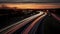 Long exposure photo of traffic on the move at dusk on the M40 motorway in England, generative ai