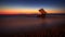 Long exposure photograhy at the rocky Kato Petres Beach landscape at dusk in Rhodes