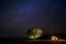 Long exposure photograph with grain. Visitor spread tent under the big tree. Star and Milky Way Astronomy at Thung kamang nature