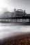 Long exposure photograph of Palace Pier, showing the illuminated pier sign, on a cold, windy, wintry day.