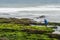 Long exposure photograph of a shellfisherman working on the rocks at Seixo beach, Torres Vedras