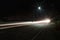 Long exposure photography of a highway with light trailing and street light