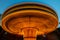 Long exposure of rotating merry go carousel