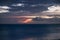 A long exposure of the sea at blue hour, as dawn breaks