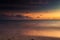 A long exposure of the sea at golden hour, as dawn breaks