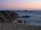 Long exposure shot on beach at dusk with milky ocean