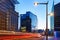 Long exposure shot of a downtown street at sunset. Skyscrapers on background with traffic lights. Brussels, Belgium.