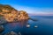 Long exposure shot of Manarola in Cinque Terre, Italy during sunset hours