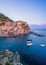 Long exposure shot of Manarola with Rock in the foreground in Cinque Terre, Italy during sunset hours