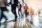 Long exposure shot of modern office lobby with business people