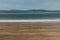 Long exposure shot of pristine deserted Australian beach at dusk in Tasmania with moody tones