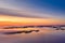 Long Exposure of Sunrise at the Paijanne lake. Beautiful scape with sunrise sky,fog, pine forest and water. Lake Paijanne, Finland