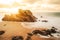 Long exposure of sunset on a beach with rocks