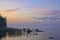 Long Exposure of Sunset at the Ladoga lake. Beautiful scape with stone beach, reeds and water. Ladoga lake, Karelia, Russia