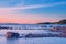 Long Exposure of Sunset at the Paijanne lake. Beautiful scape with stone beach, pine forest and water. Lake Paijanne