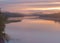 Long Exposure of Sunset at the Paijanne lake. Beautiful scape with sunrise sky, pine forest and water. Lake Paijanne, Finland