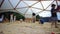 Long exposure time lapse of a crowded playground sandbox full of unknown kids