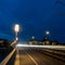 Long exposure of traffic crossing the Carola Bridge over the Elbe River in Dresden at night