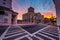 Long exposure of traffic at the Four Corners at sunset, in Charleston, South Carolina