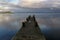 Long exposure view of seagulls perching on the dock over the sea