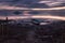 Long exposure view of shore of Trasimeno lake Umbria, Italy with a little boat and moving clouds