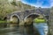 A long exposure view to produce smooth, dreamy water flowing beneath the Llawhaden bridge, that spans the River Cleddau, Wales