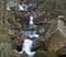 Long exposure waterfal cascade in Jizerske hory, Jizera mountain, forest on Cerny Stolpich black creek in czech republic