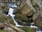 Long exposure waterfal cascade in Jizerske hory, Jizera mountain, forest on Cerny Stolpich black creek in czech republic