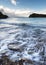 Long exposure of waves receding on beach ladnscape