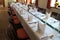 Long festive decorated table with white tablecloth