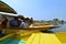 Long flat-bottomed wooden boats, shikaras, on the Dal Lake in Srinagar, India.