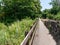 Long footpath with wooden fence