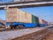 Long freight train of Idler flatcars loaded with intermodal 40-fts containers on the marshalling yard of Trans-Siberian Railway