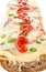 Long French bread pizza with ketchup